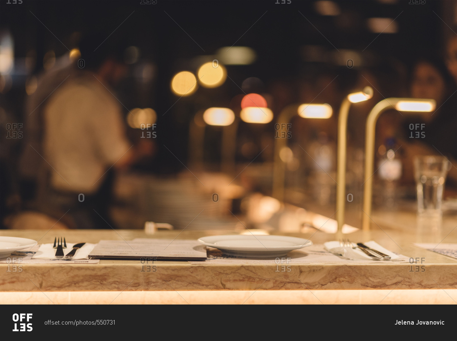 Food restaurant bar at evening with blurred people in background. stock  photo - OFFSET