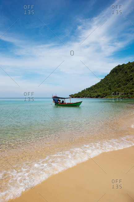 Longtail boat at a pristine beach