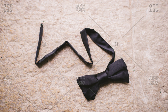 Man's bowtie on a stone floor