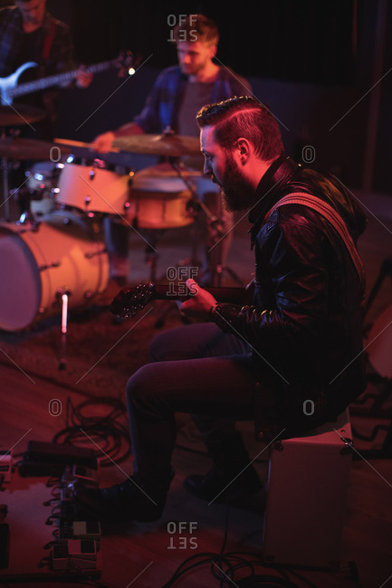 Band performing in recording studio