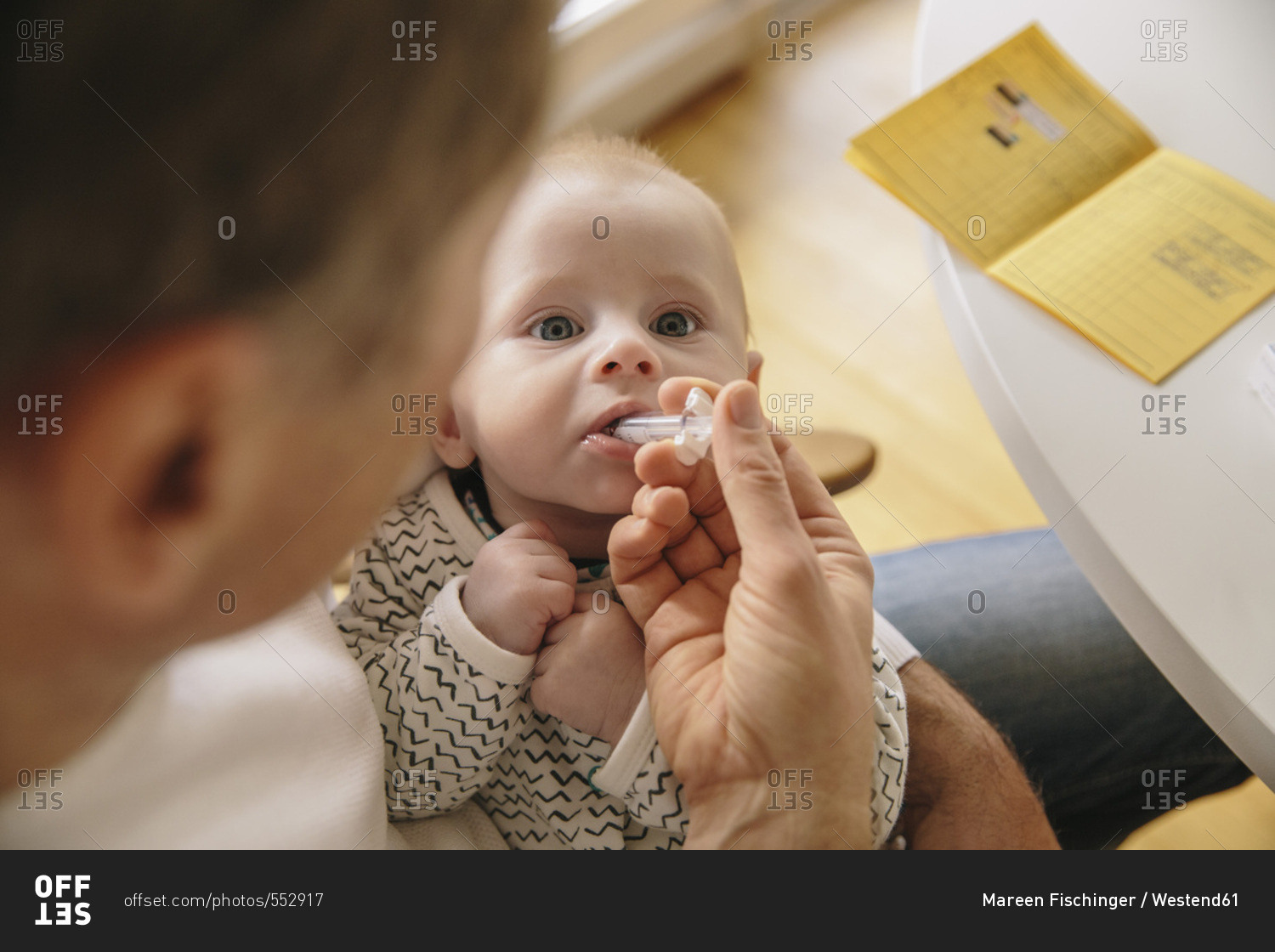 Three-month-old baby receiving oral vaccination