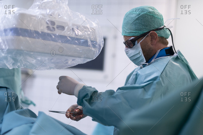 Interventional radiologist setting seam for fixing permanent catheter