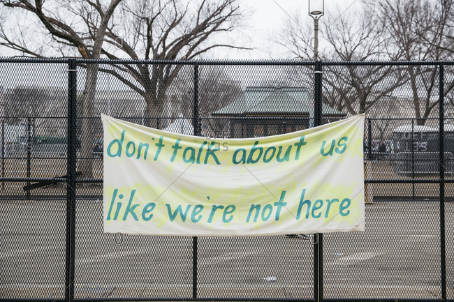 Protest sign hanging on a fence from the Women\'s March on Washington, DC
