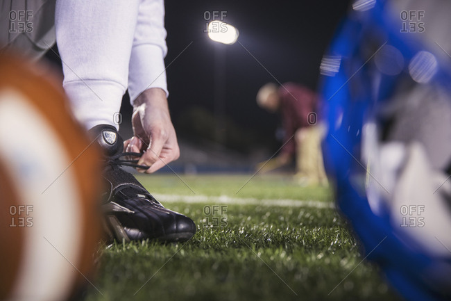 American football players walking on field stock photo - OFFSET