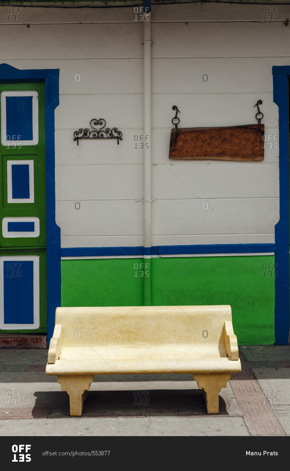 Cement bench between two colonial houses in the small town of Salento, Colombia