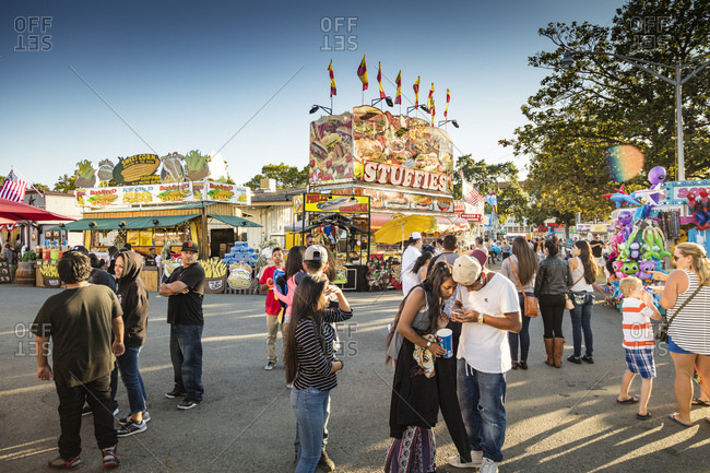 Sonoma County, California - July 27, 2016: A group of fair attendees congregate in the food pavilion of the Sonoma County Fair in summer.