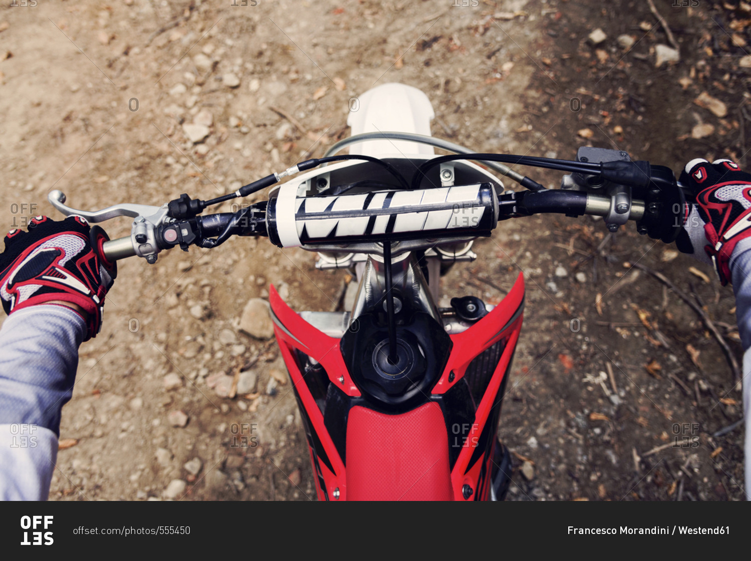 Bilker holding handlebar of his motor bike- close up