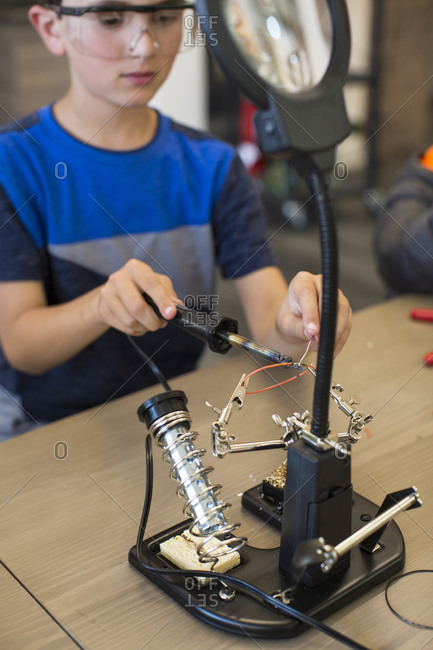 Child at soldering station