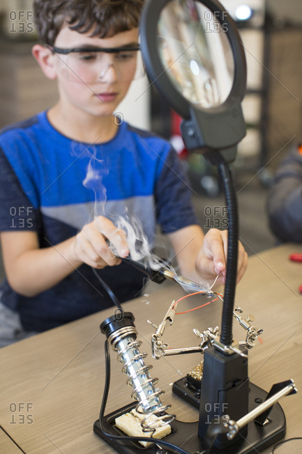 Child at soldering station