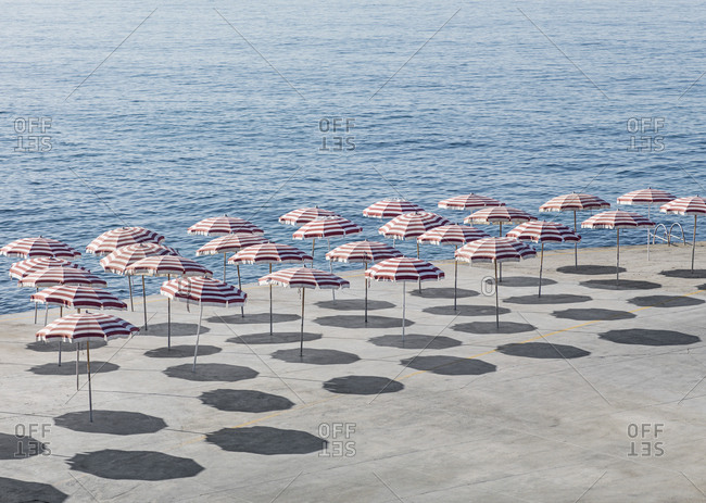 High angle view of parasols at beach during sunny day