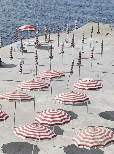 High angle view of striped parasols at beach