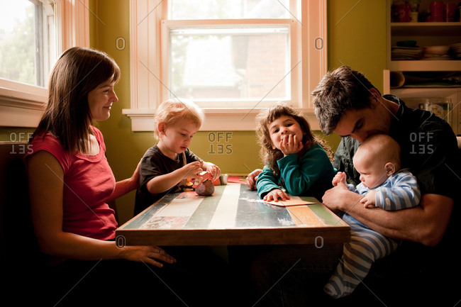 Family sitting at kitchen table