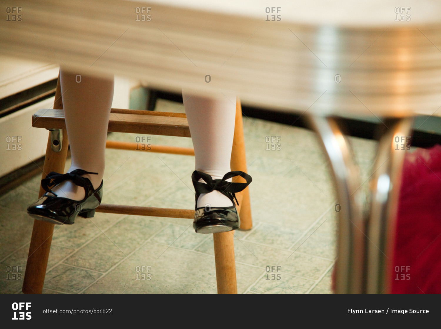 Foot under table. Shoes under Table.