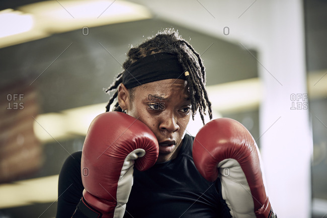 Determined female boxer  in gym