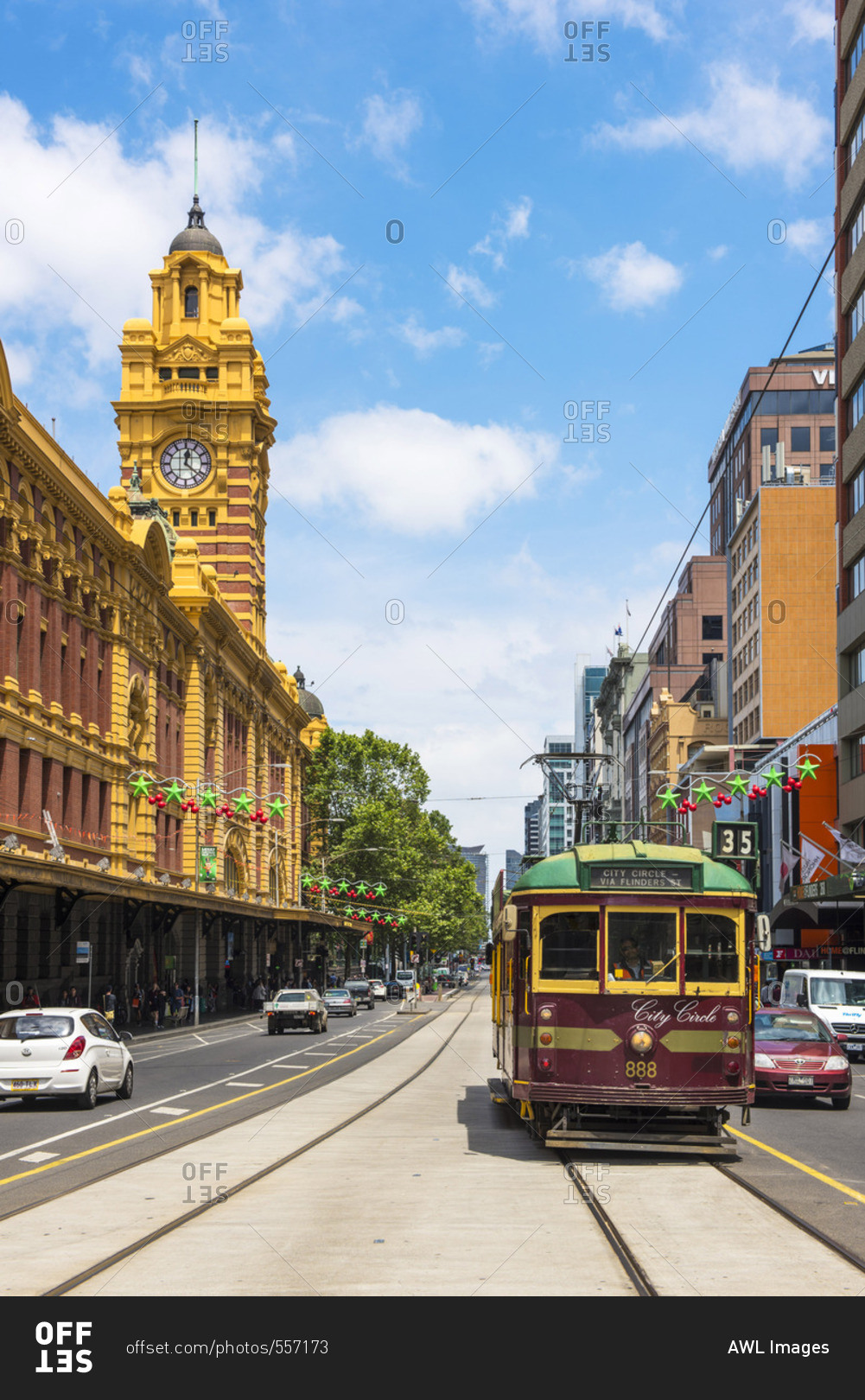 Melbourne, Australia - December 6, 2016: Melbourne, Victoria, Australia.  Flinders Street Station and the historical old tram. stock photo - OFFSET