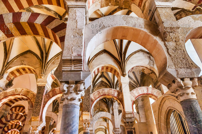 Arches Pillars Mezquita, Cordoba, Spain. Created in 785 as a Mosque, was converted to a Cathedral in the 1500. 850 Columns and Arches