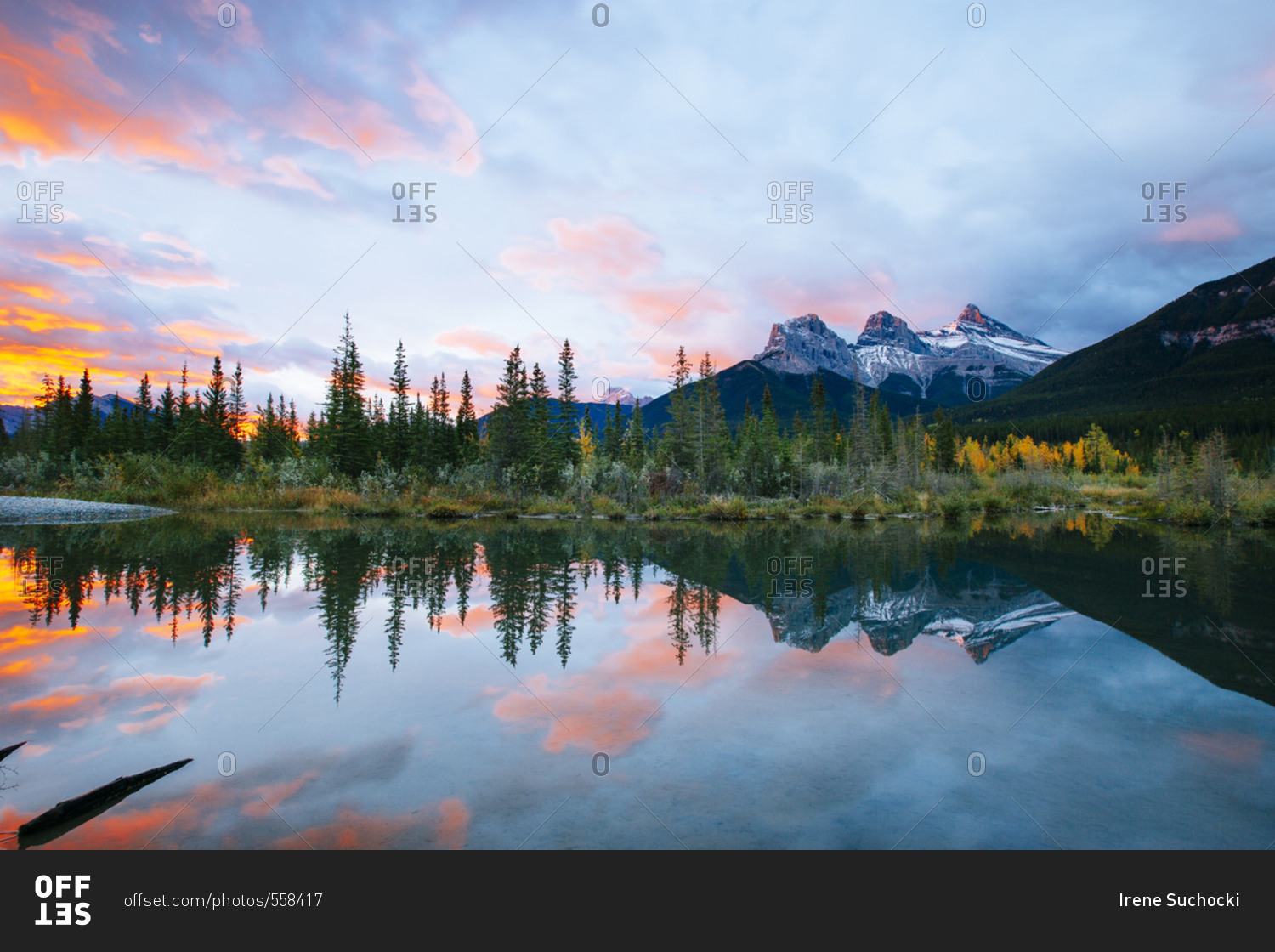 Mountain reflections in mountain lake at sunrise