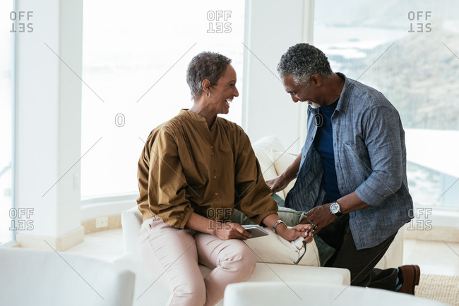 Mature couple  laughing at home