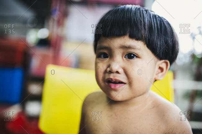 Nervous looking Malaysian toddler girl