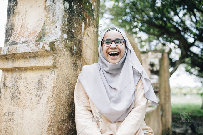 Laughing Malaysian woman in Islamic dress