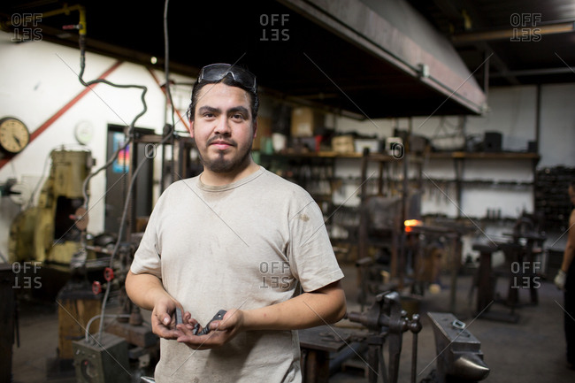 Portrait of male metalsmith in workshop