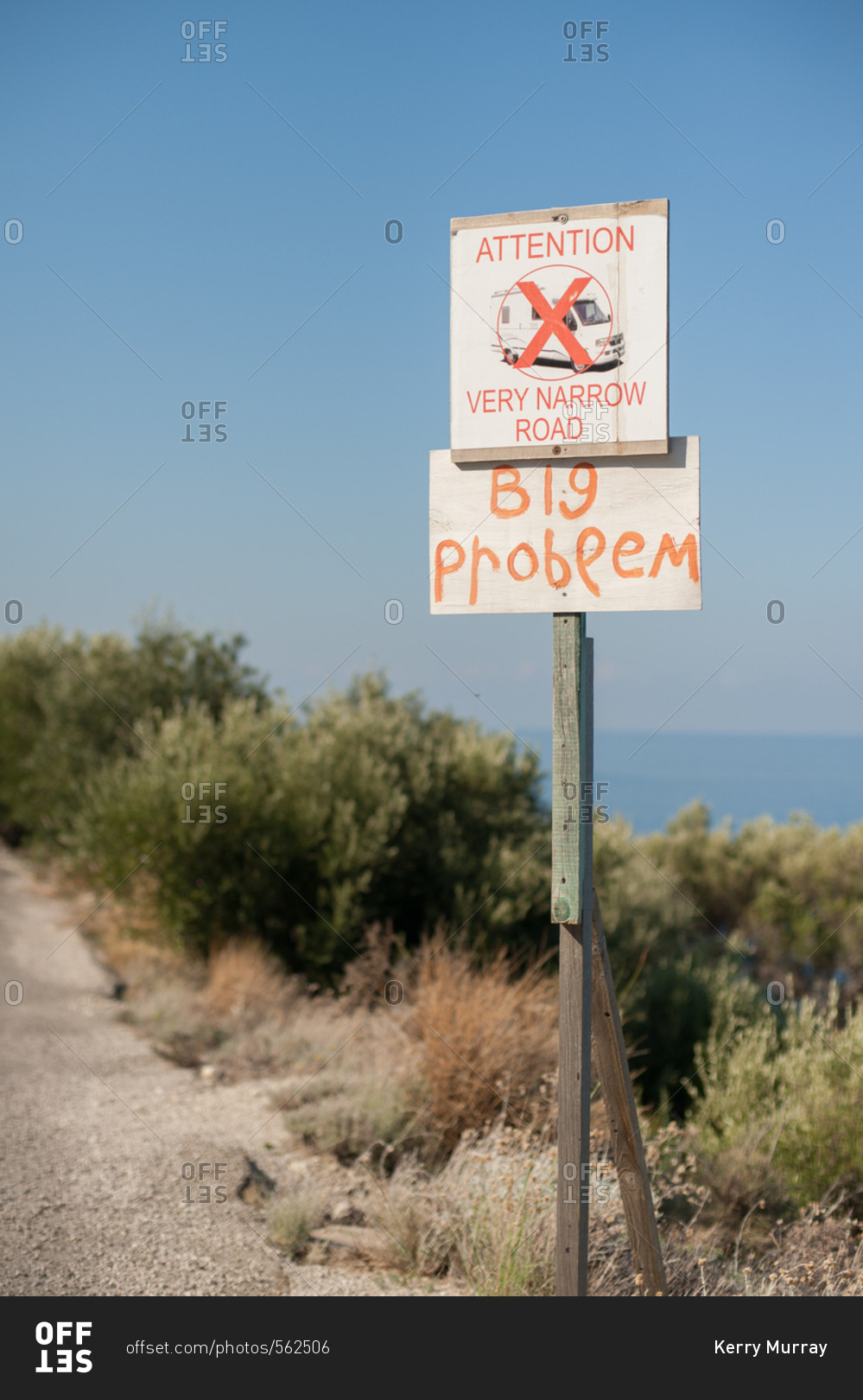 Warning sign to drivers on narrow road in Greece