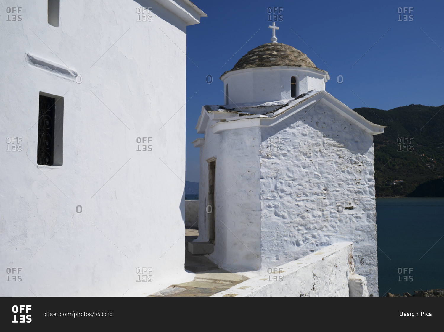 Whitewash church with cross on a greek island along the Aegean sea, Panormos, Thessalia Sterea Ellada, Greece