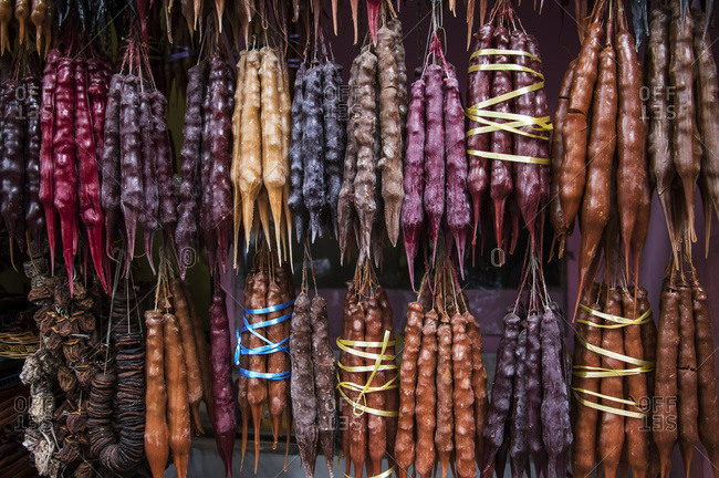 Churchkhela, traditional Georgian candies made from nuts, almonds, walnuts and hazelnuts threaded onto a string, dipped in thickened grape juice or fruit juices and dried, Tbilisi, Georgia