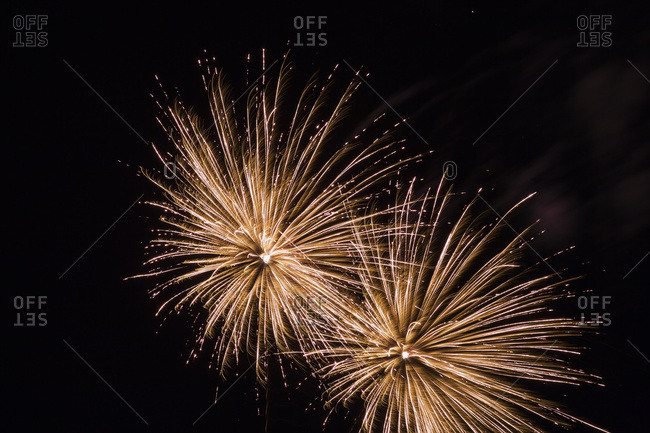 Golden fireworks in night sky, Quebec, Canada