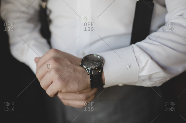 Groom checking his watch - Offset