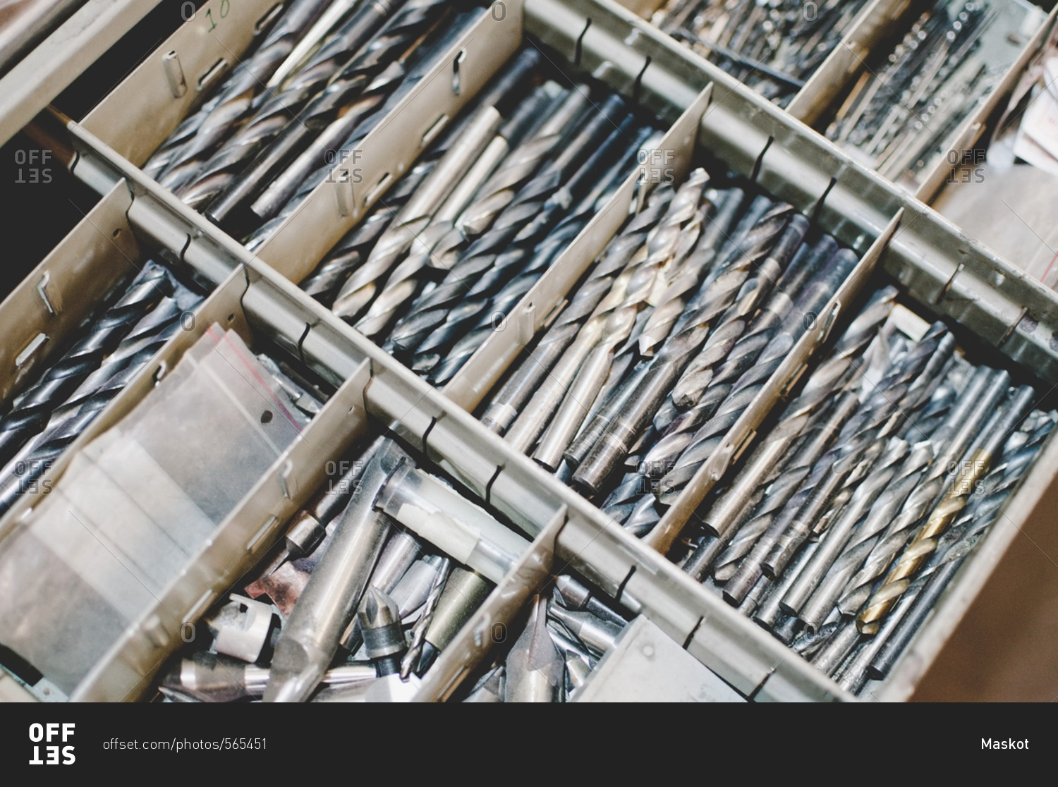 High angle view of drill bits in toolbox stock photo OFFSET