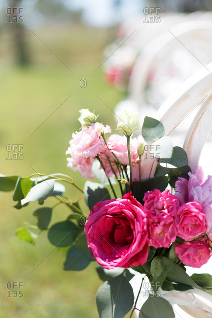 Arrangement of roses at outdoor wedding