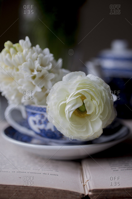Breakfast tea on a book with flowers