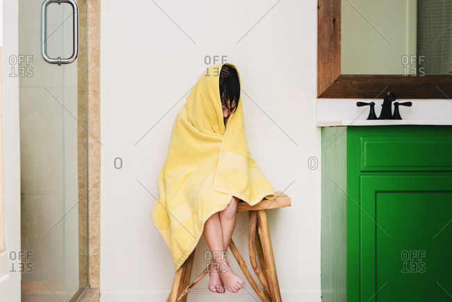 Young girl wrapped in a towel after a bath