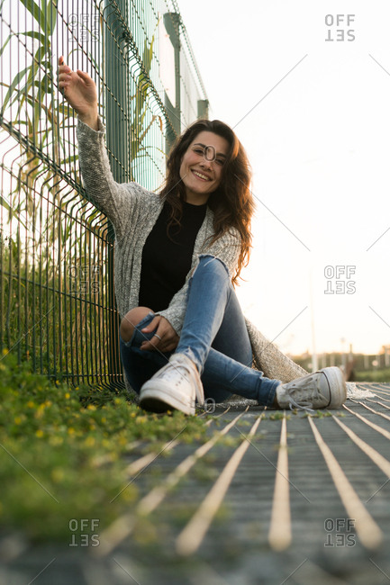 beautiful girl poses for camera in the city Stock Photo by simbiothy