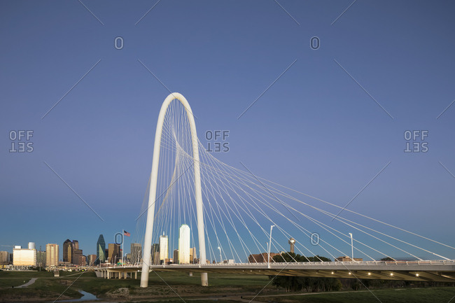 USA, Texas, Dallas - October 20, 2016: Margaret Hunt Hill Bridge and skyline at dusk