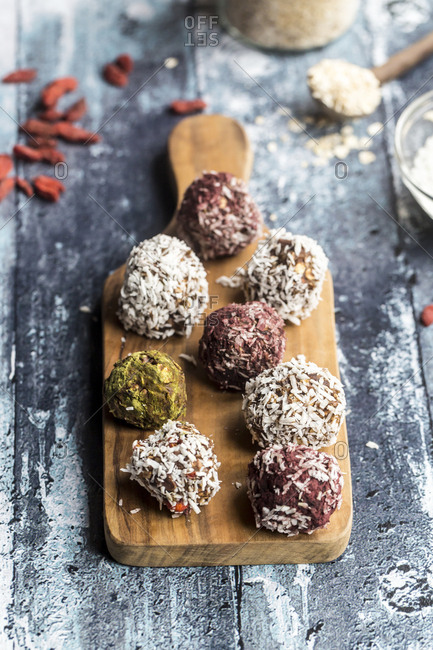 Various Bliss Balls on wooden board