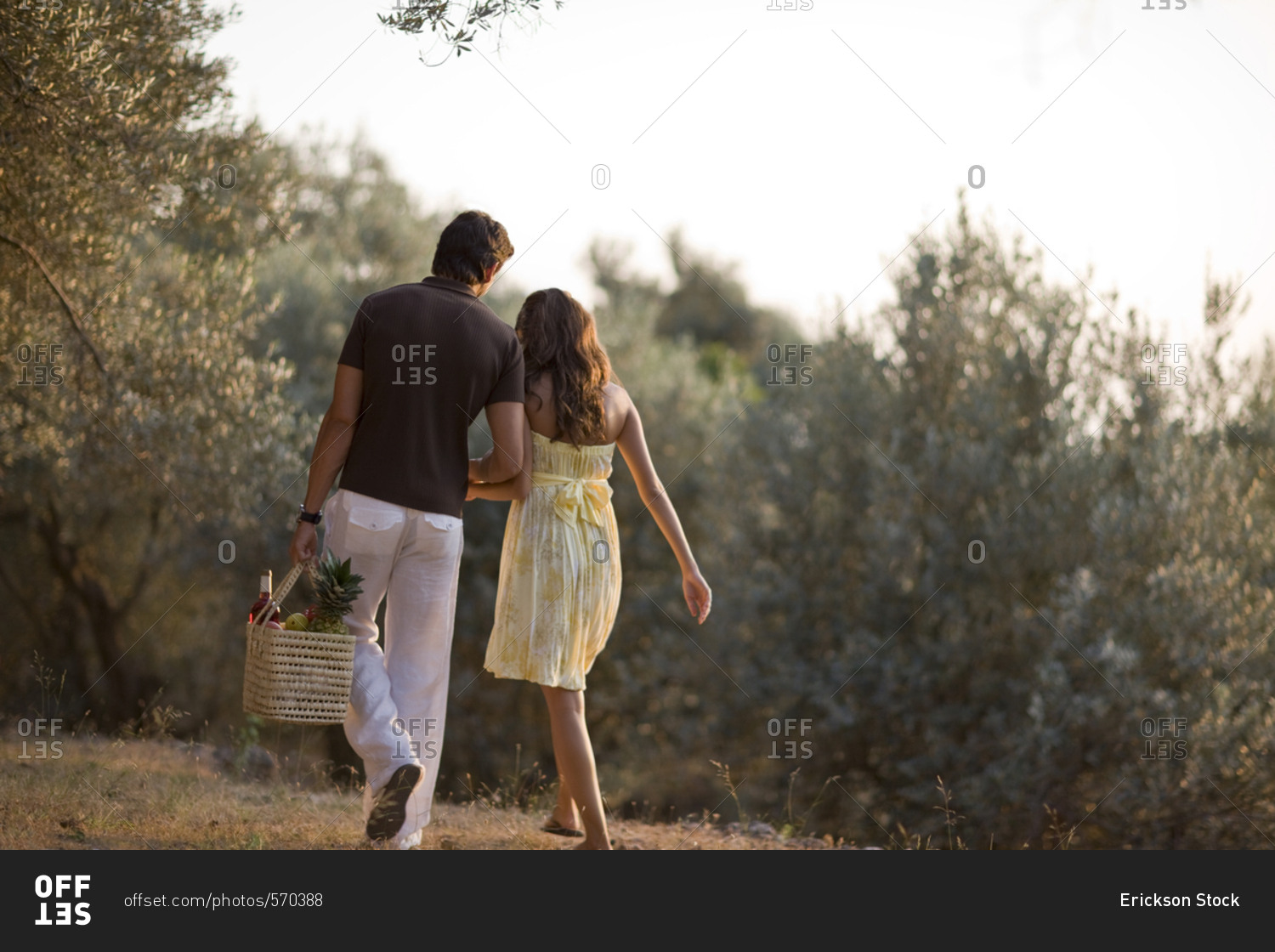 Couple walking with a picnic basket