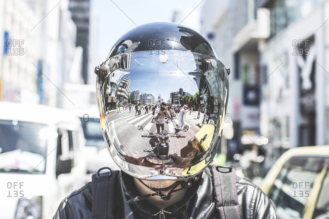 Tokyo, Japan - May 18, 2016: Reflections from a helmet of a motorbike in Tokyo.