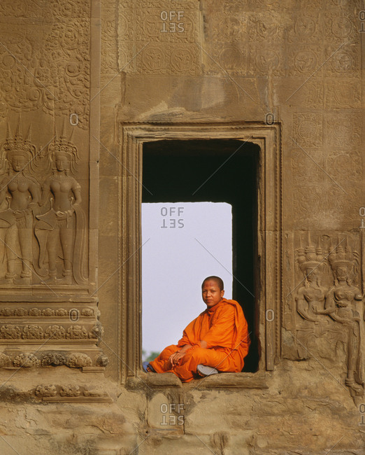 Siem Reap, Cambodia - December 19, 2014: Cambodia, Siem Reap, Angkor Wat temple.  junior priest