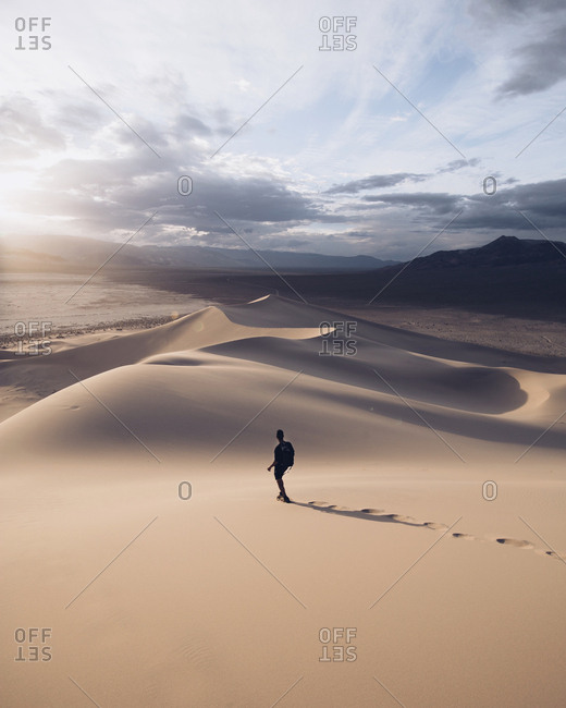 Person walking in Death Valley dunes