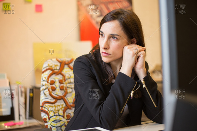 Young businesswoman sitting at workplace