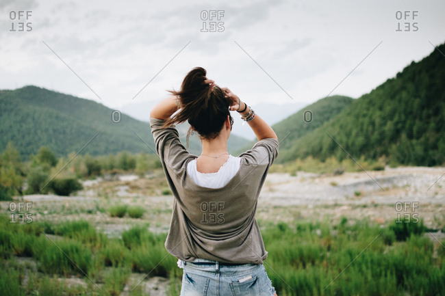 Back View Woman Nature Touching Hair Stock Photo - Offset-6304