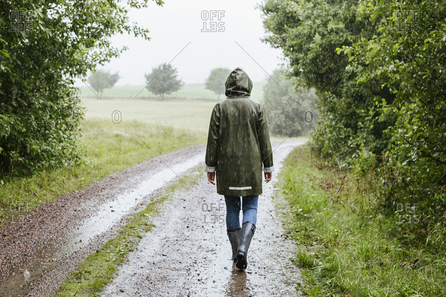 Man Walking In The Rain