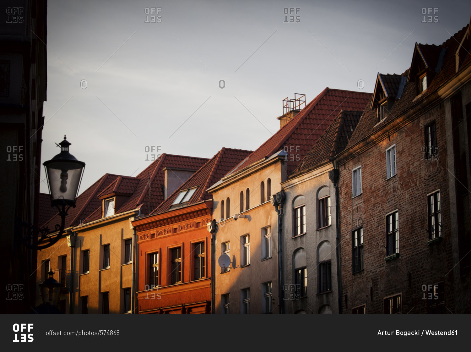 Poland Torun row of houses at the old town at sunset stock photo OFFSET