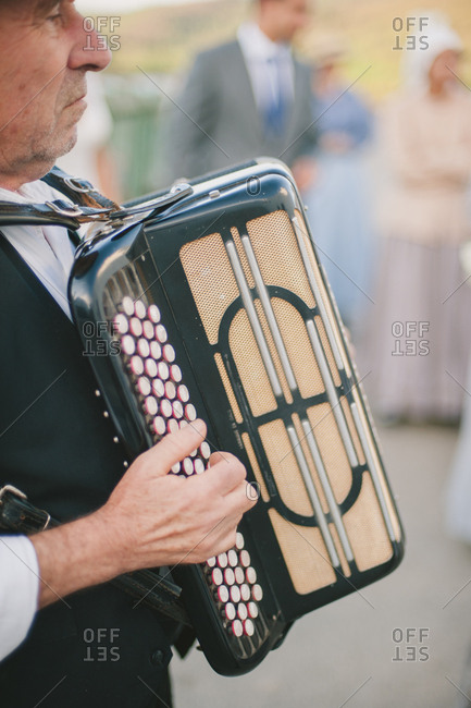 Man playing accordion at wedding