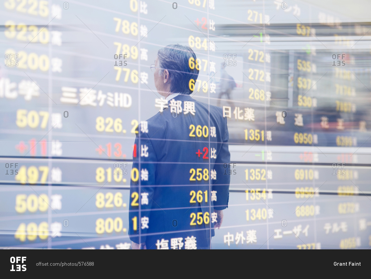 Man watching stock exchange, Tokyo, Japan