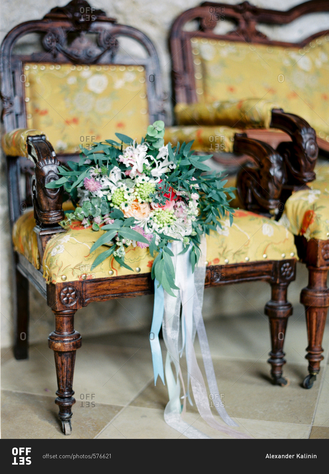 Flower bouquet in antique armchair