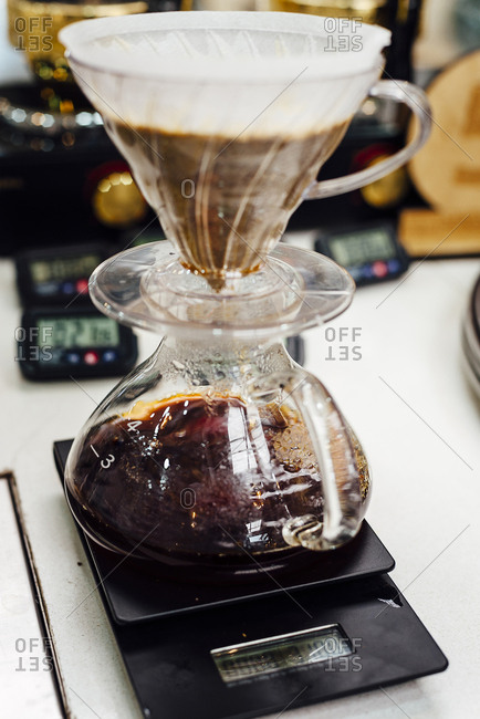 Paper cone filter in a glass pour over coffee maker in Bogota, Colombia