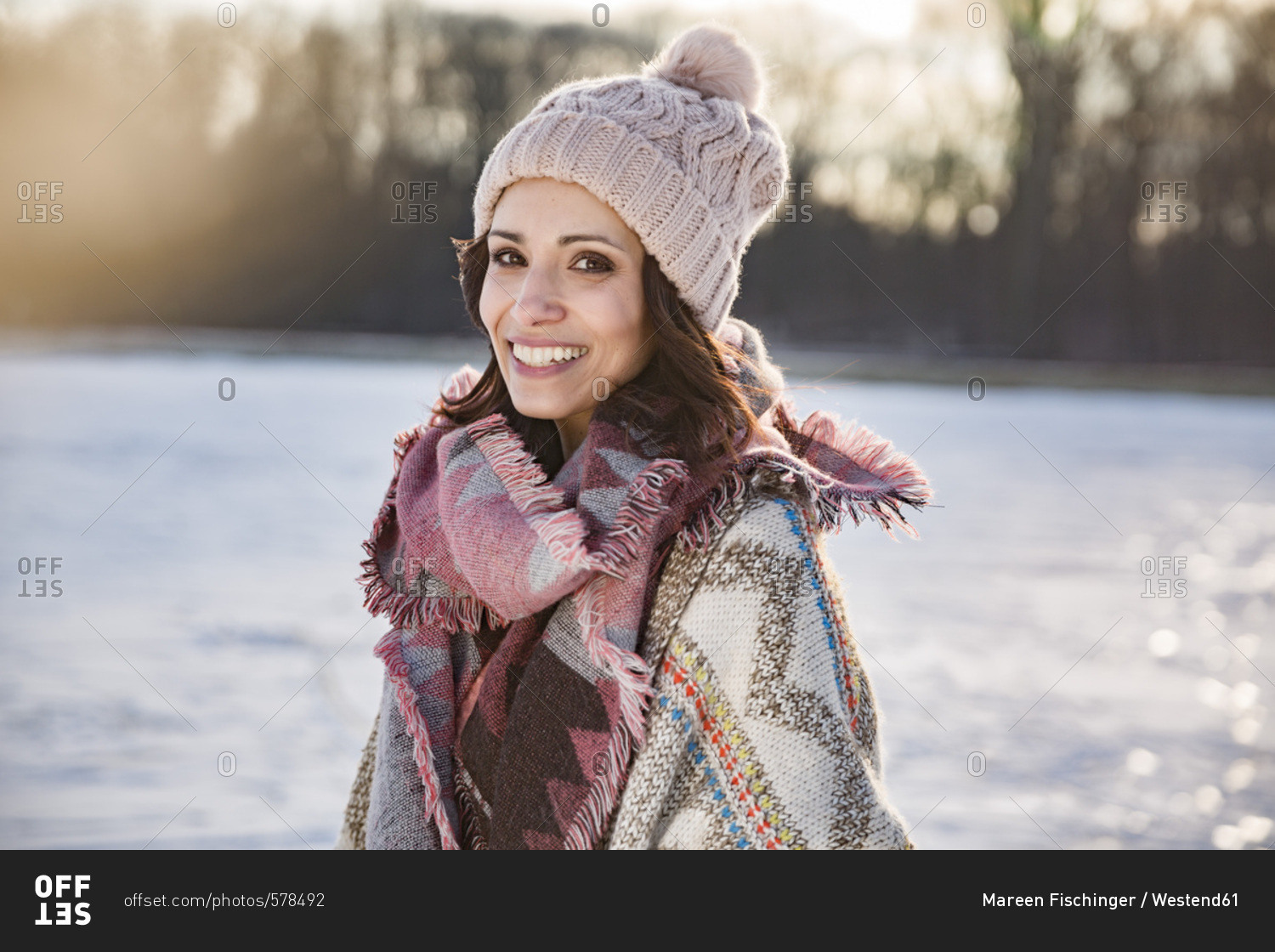 Portrait of happy woman outdoors in winter